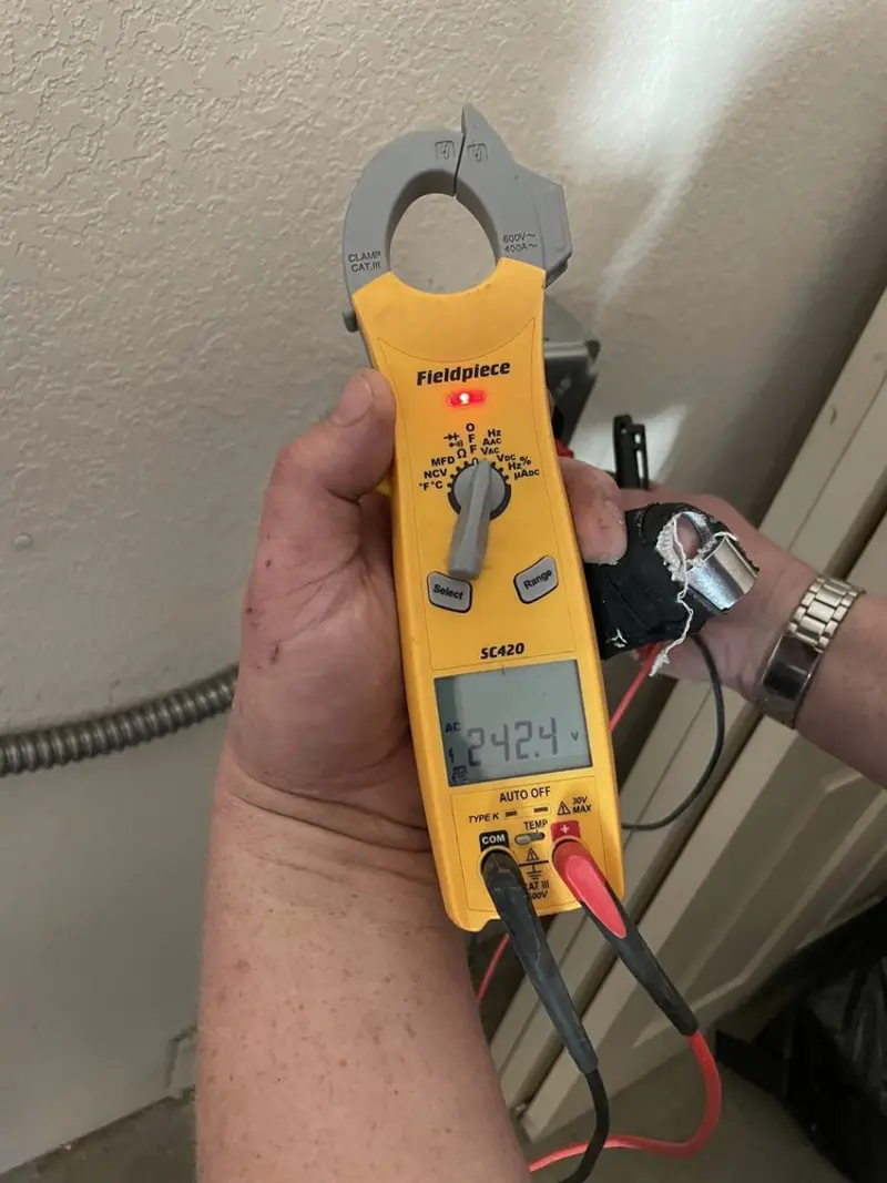 Voltage testing with clamp meter during Hot Tub / Pool Electrical Wiring in St. Albans